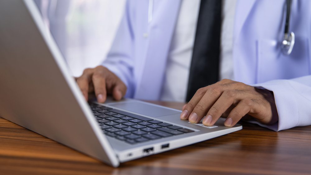 Doctors using a laptop