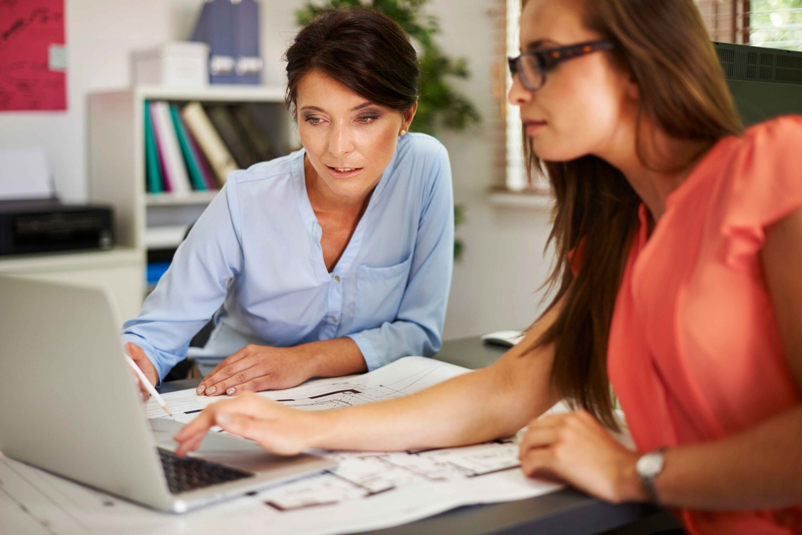 Two-women-consulting-data-on-the-computer